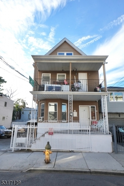 a front view of a house with a porch