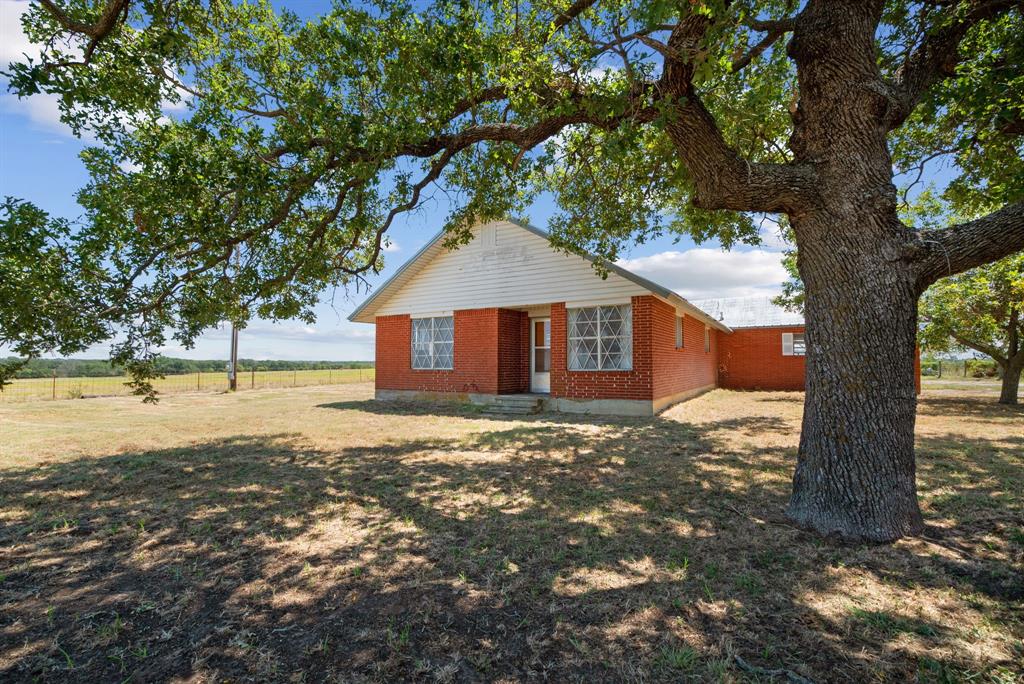 a house with trees in the background