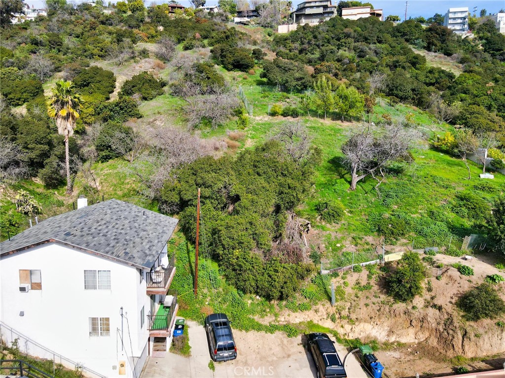 a view of house with a yard