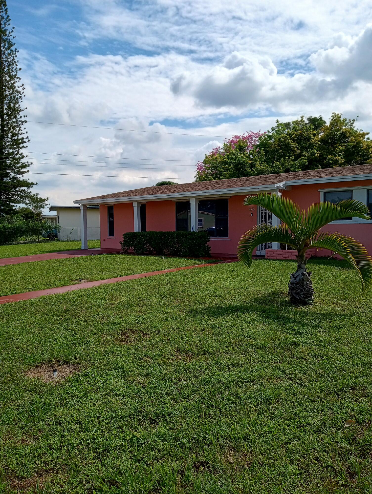 a view of a backyard of the house