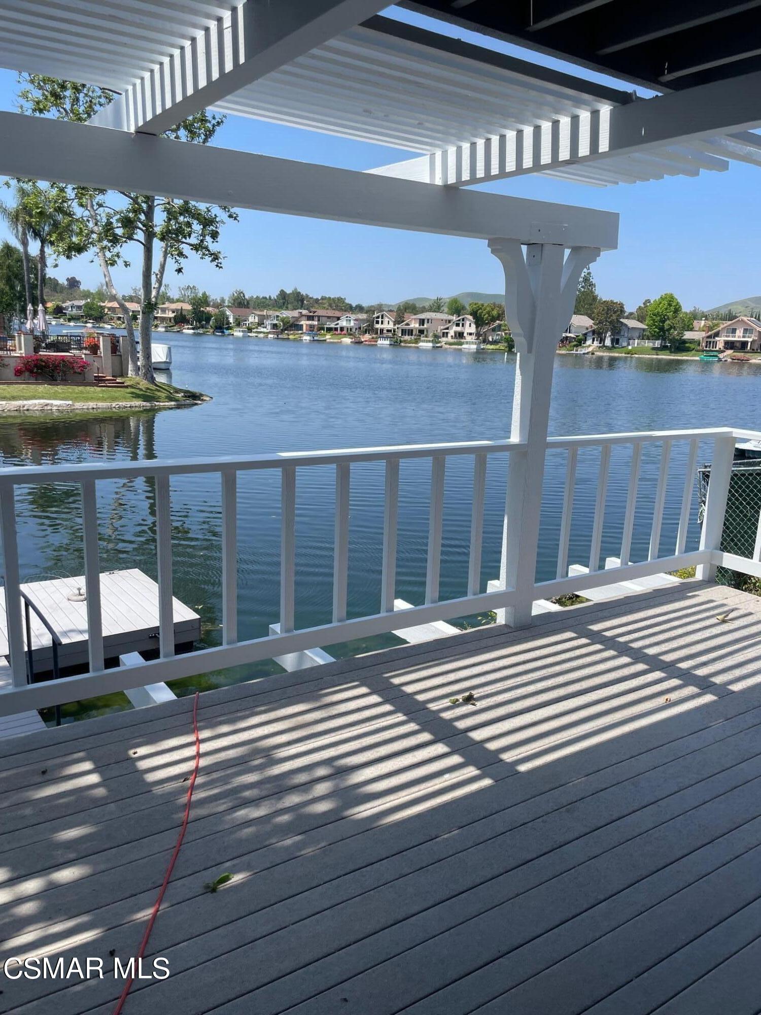 a view of a patio with a table and chairs