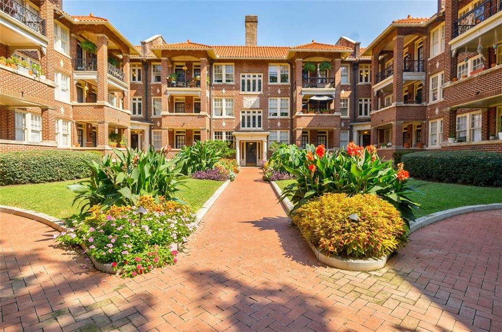 a view of a building with a garden