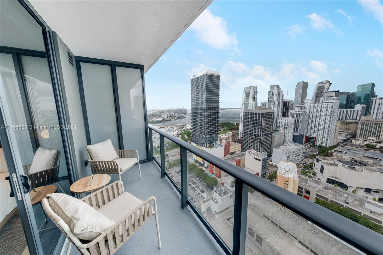 a view of a balcony with chairs