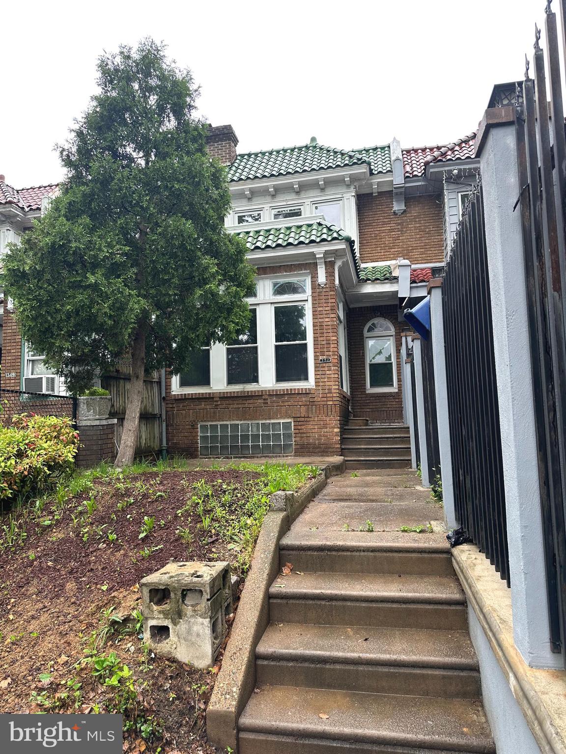 a front view of a house with a porch