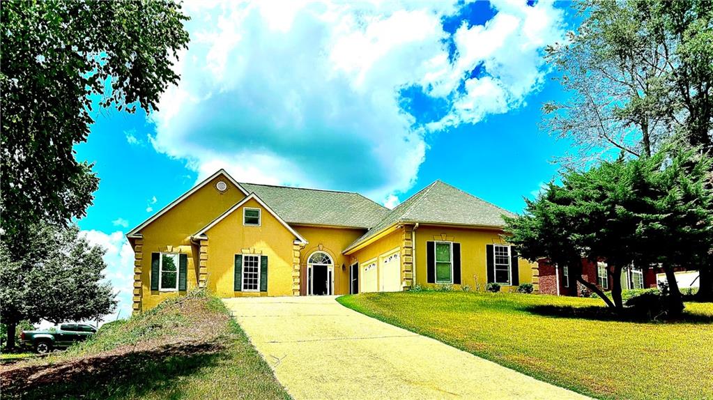 a front view of a house with a yard