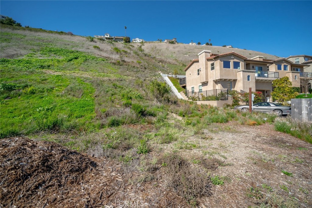 a view of a big house with a yard