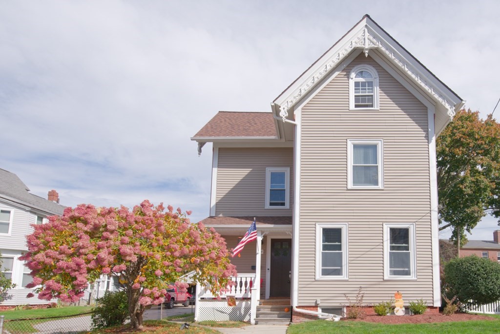 a front view of a house with a yard