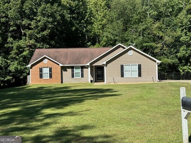 a front view of a house with a yard