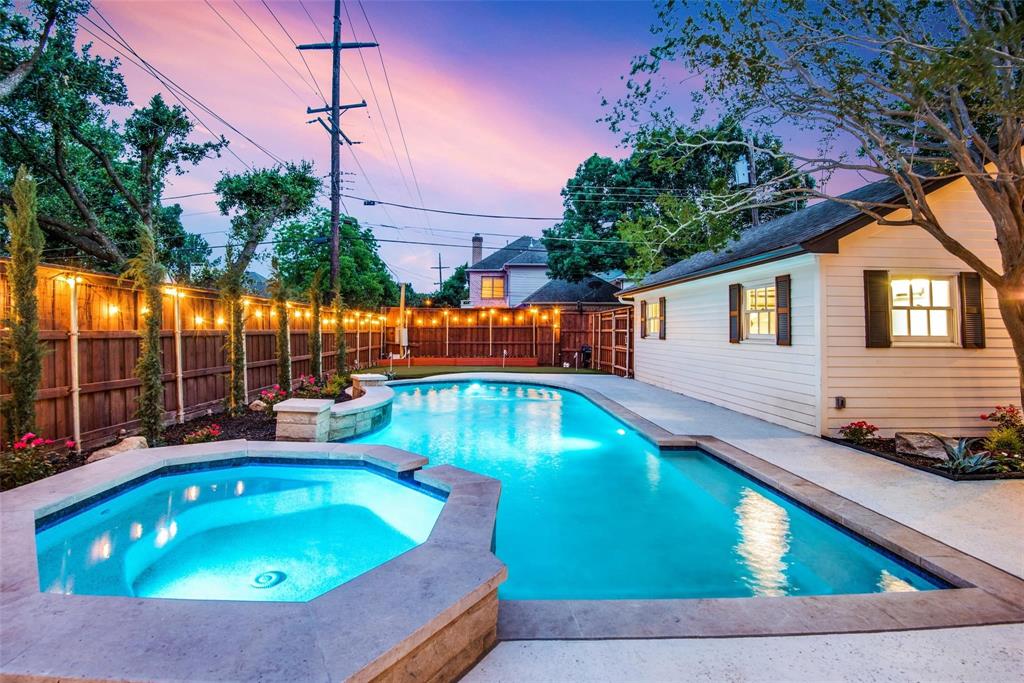 a swimming pool with outdoor seating and yard