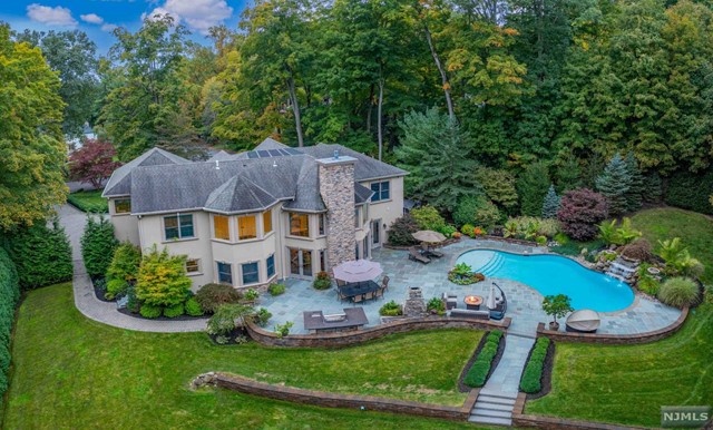 an aerial view of a house with garden space and street view