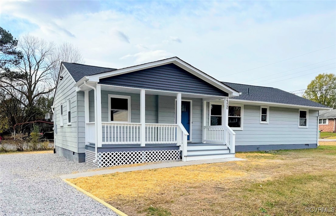 Single story home with covered porch and a front l