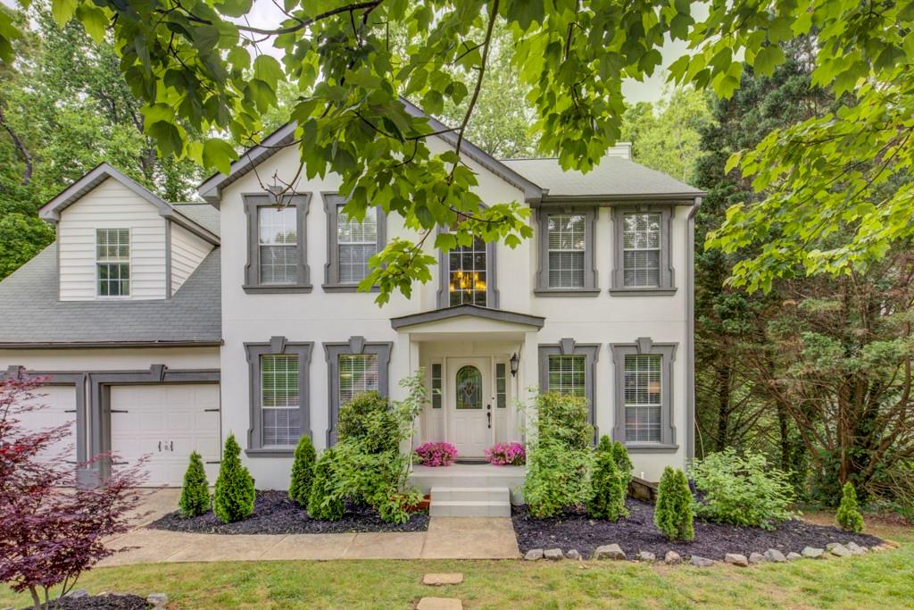 front view of a house with a yard