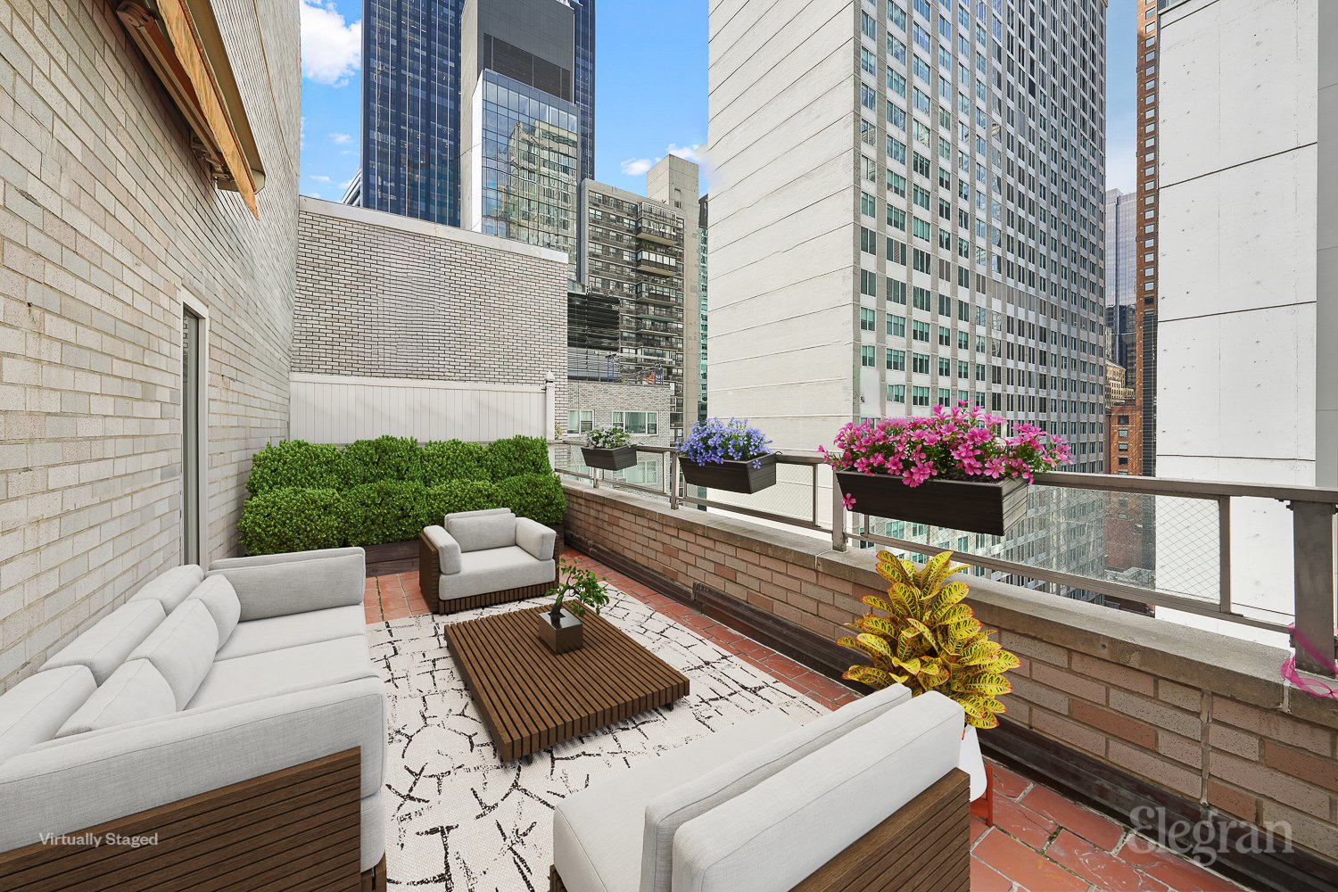 a view of a patio with couches table and chairs and potted plants