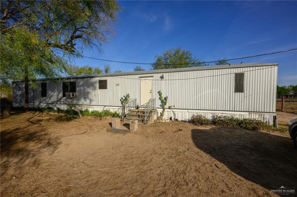 a view of a backyard of the house