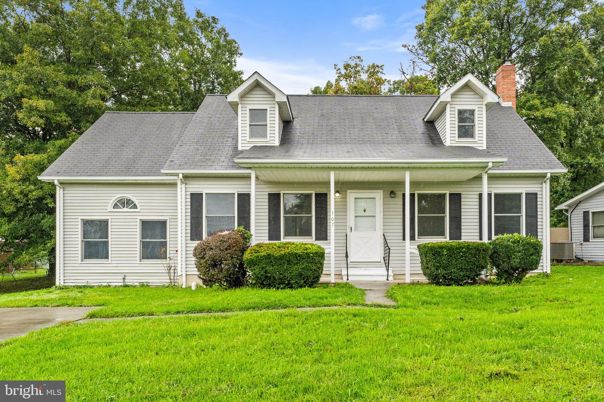 front view of a house with a yard