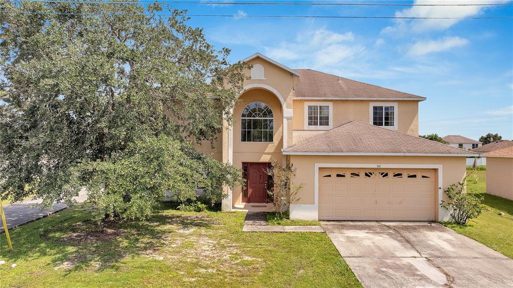 a front view of a house with a yard