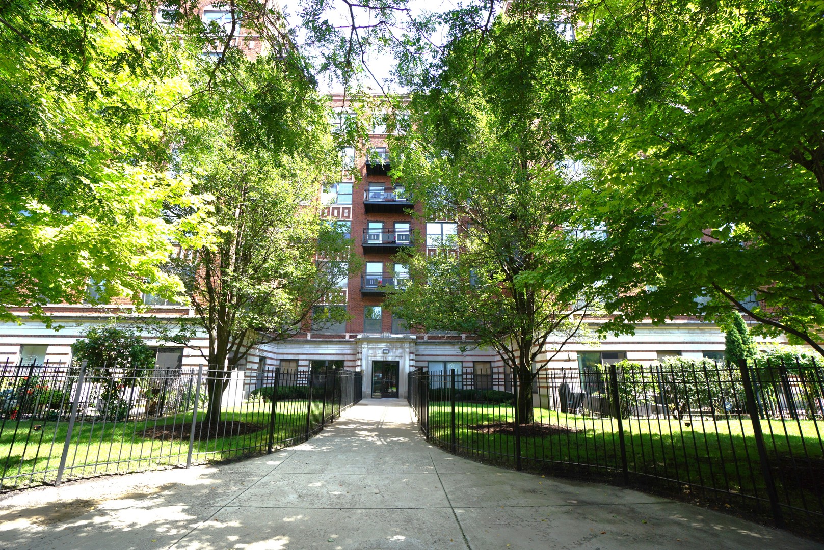 front view of a house with a garden