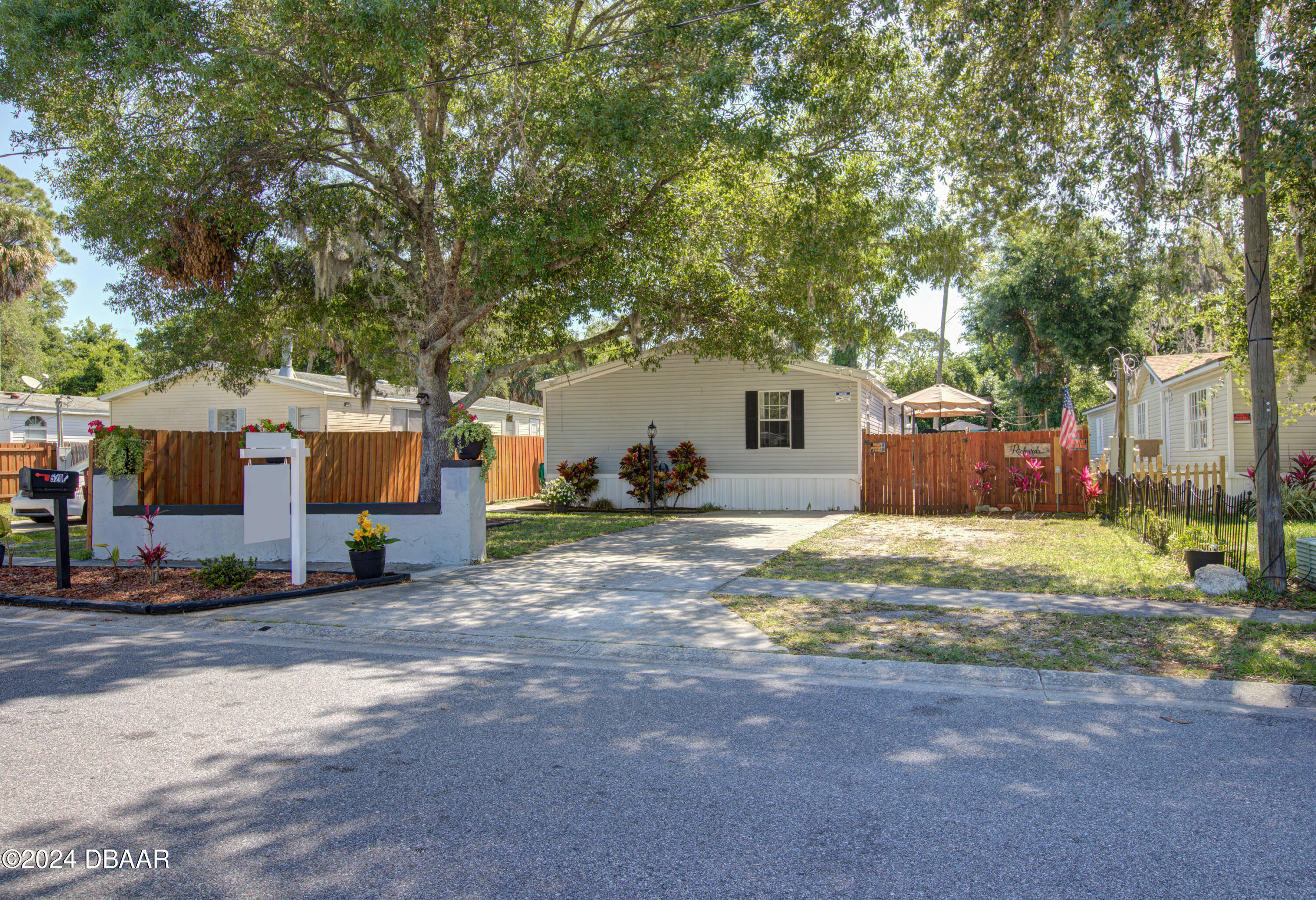 a view of a house with a yard and garage