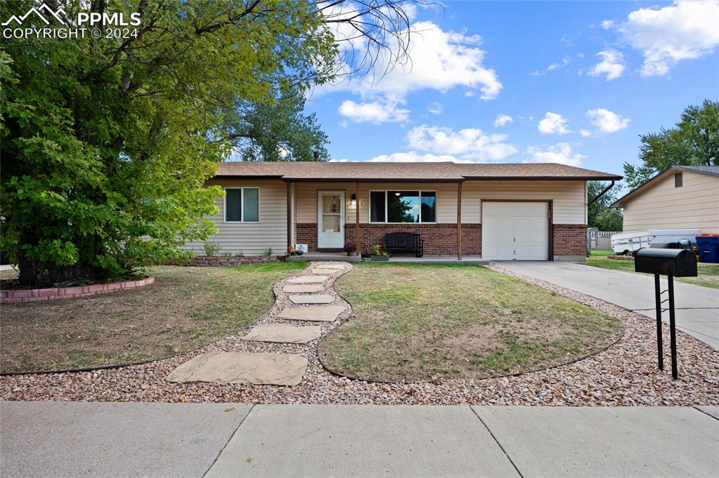 front view of a house with a yard