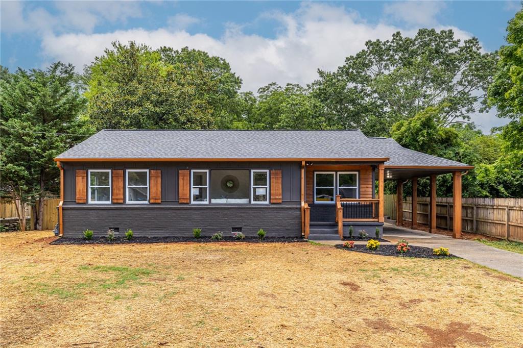 a front view of a house with a yard covered with green space