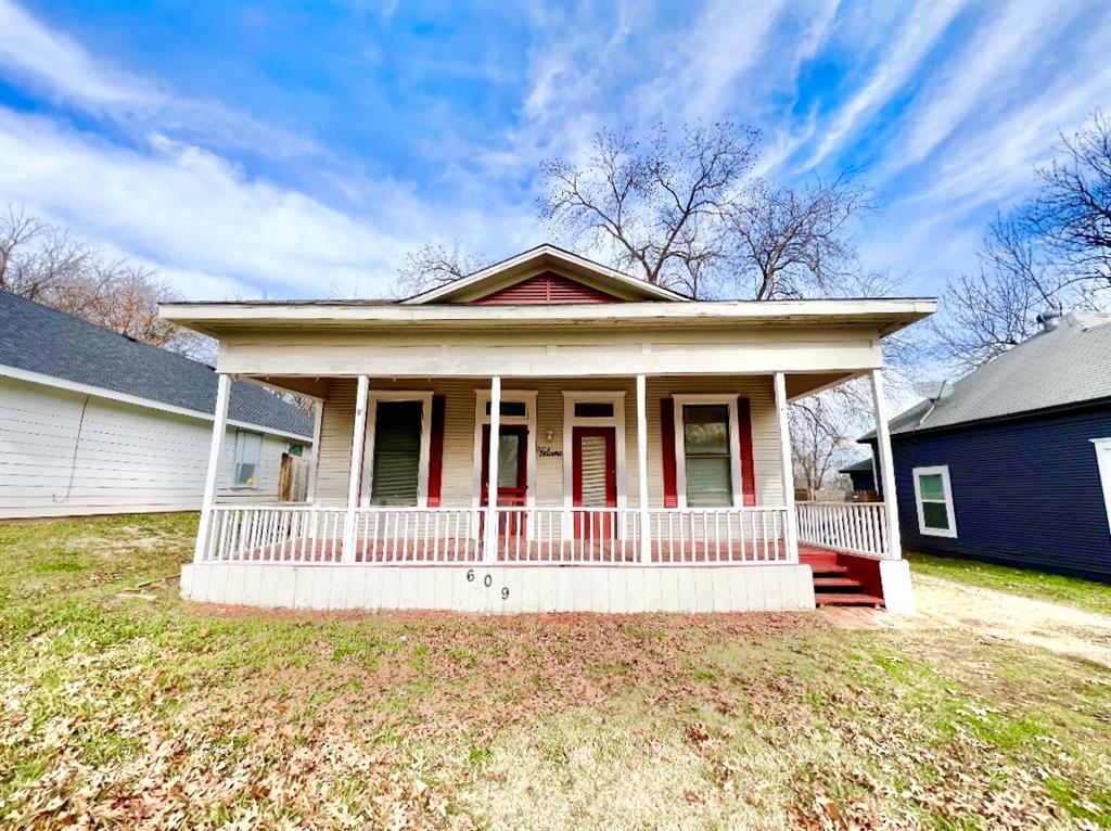 front view of a house with a small yard