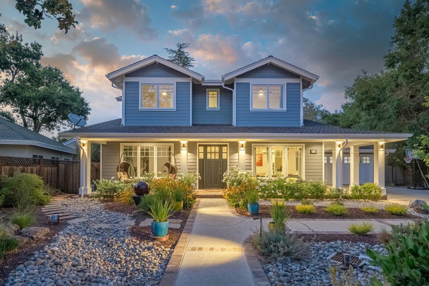 a front view of a house with garden