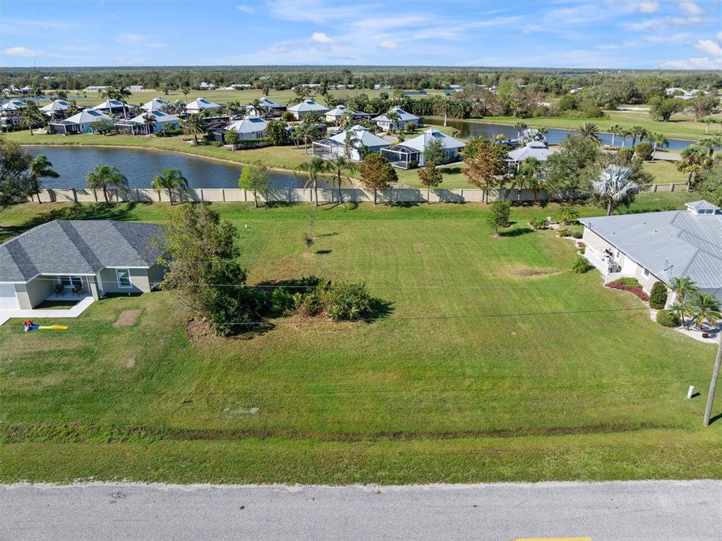 an aerial view of a residential houses with outdoor space and swimming pool