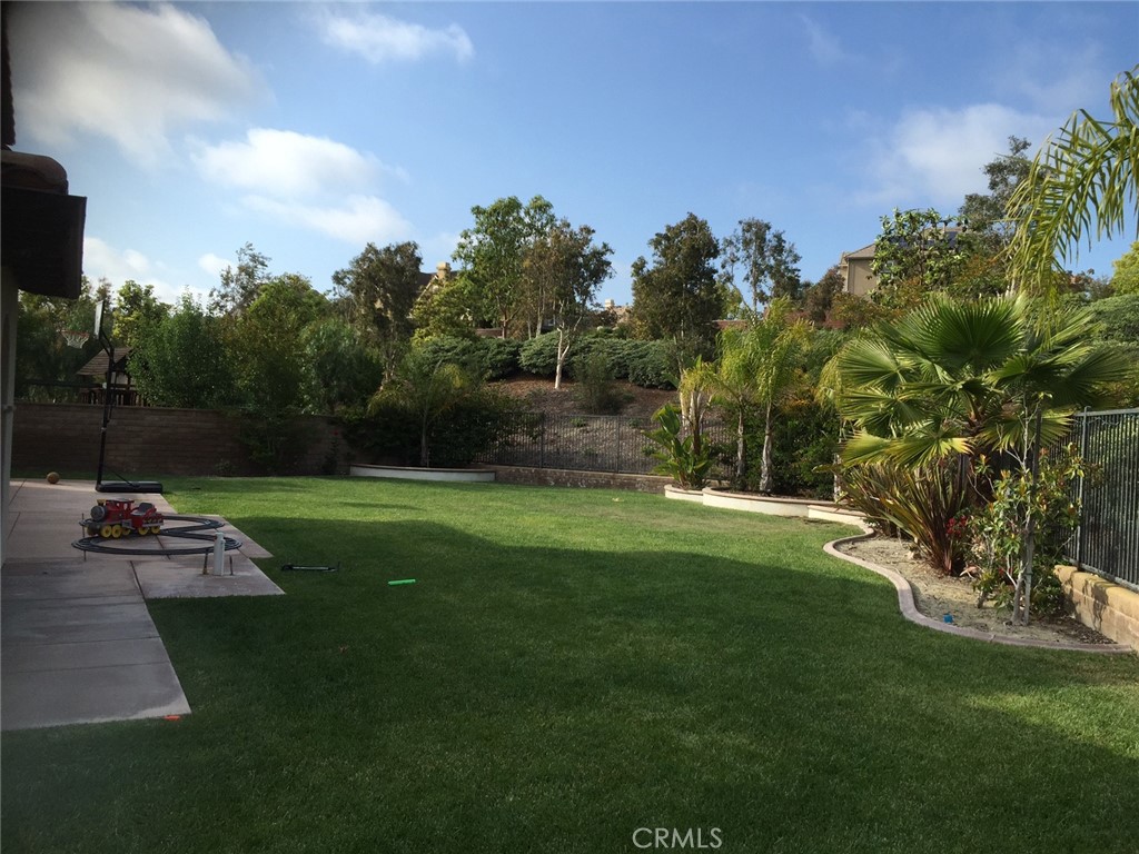 a view of a backyard with sitting area