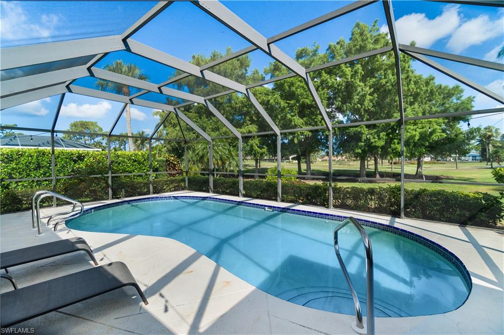 a view of a backyard with a swimming pool