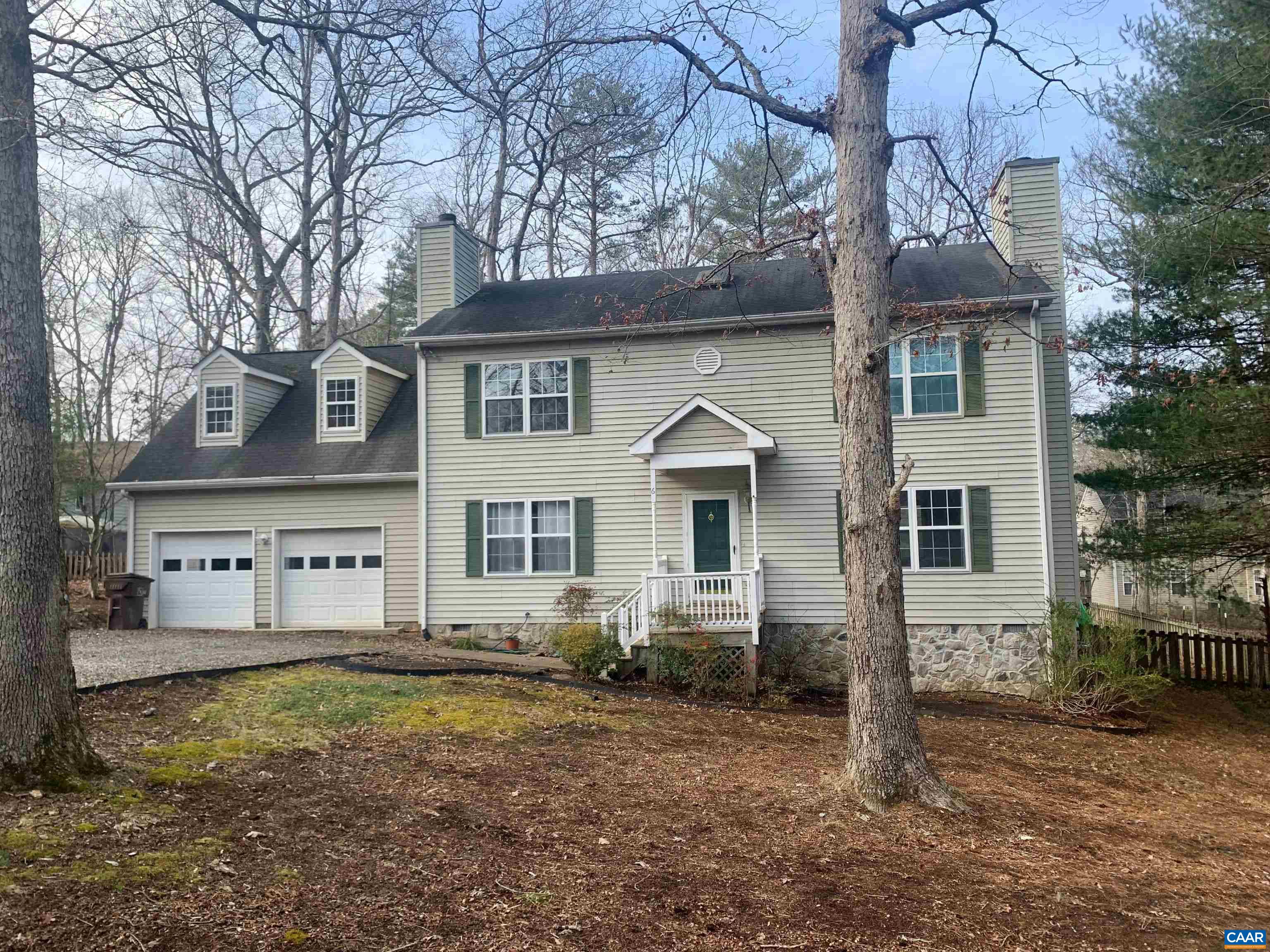 front view of a house with a yard