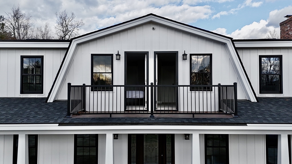 a view of a house with iron stairs