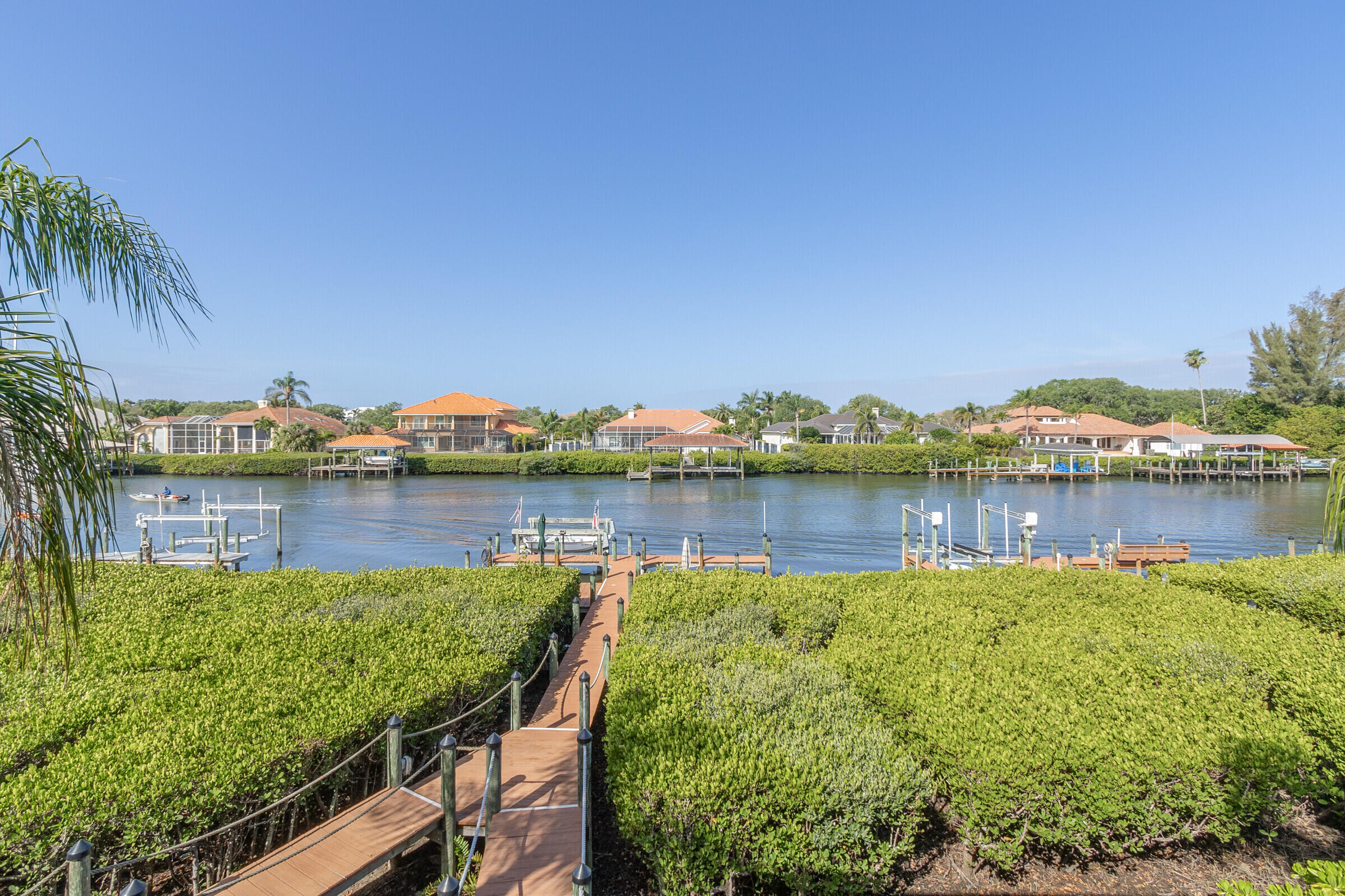 a view of a lake with houses in the back