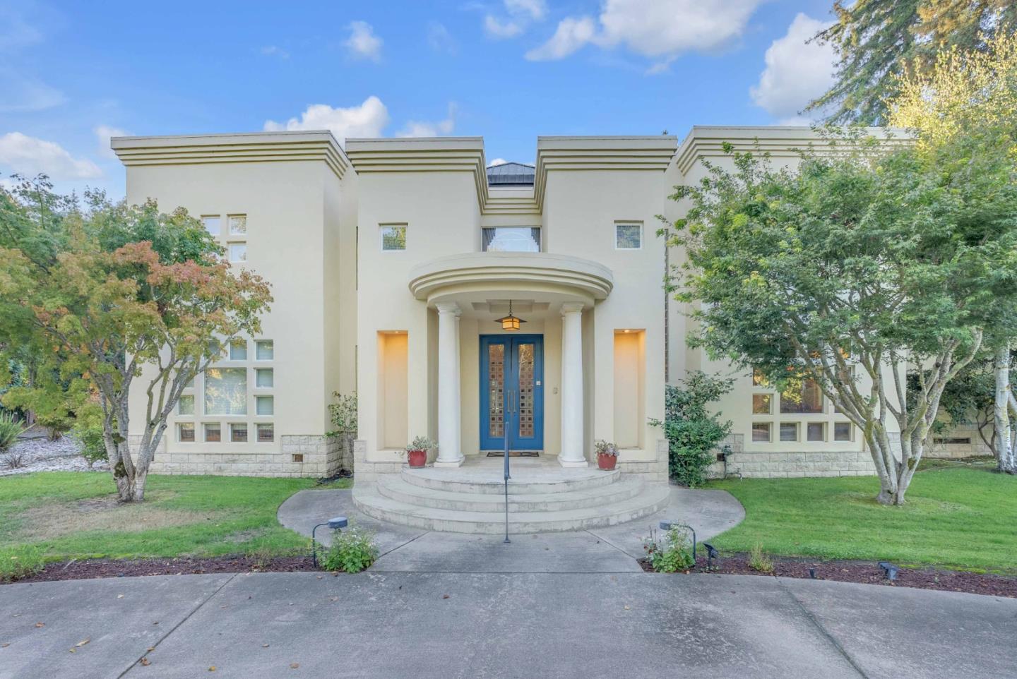 front view of a house with a garden