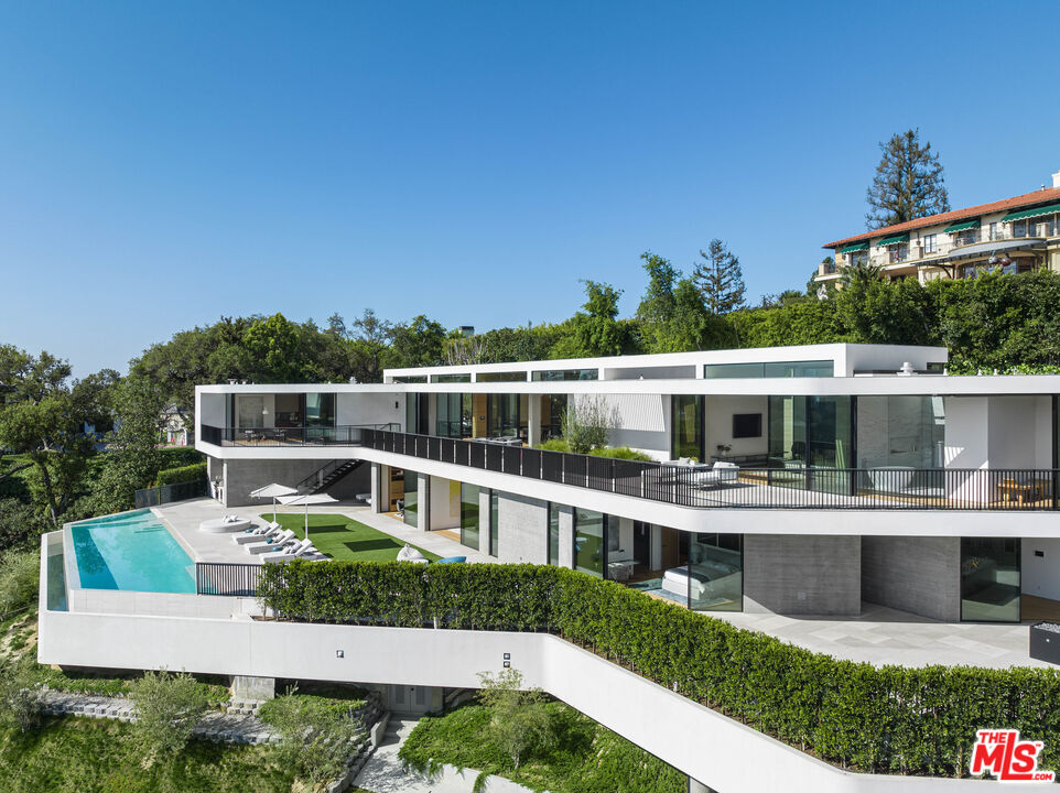 a aerial view of a house with a yard