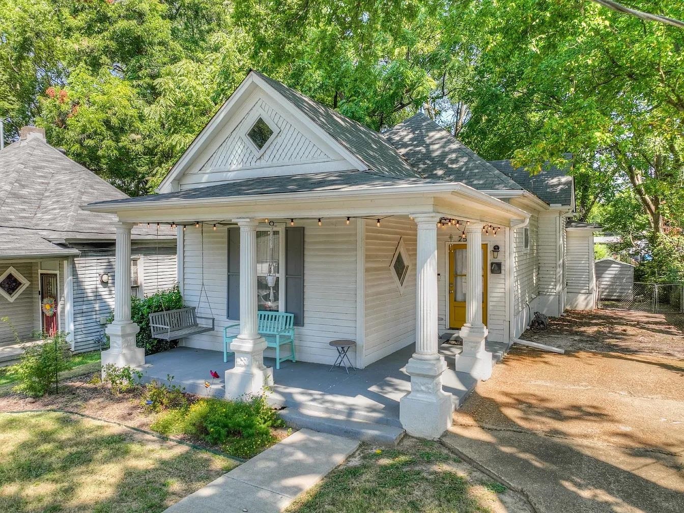 front view of a house with a yard