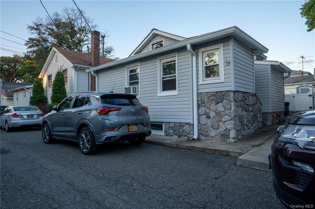 a car parked in front of a house