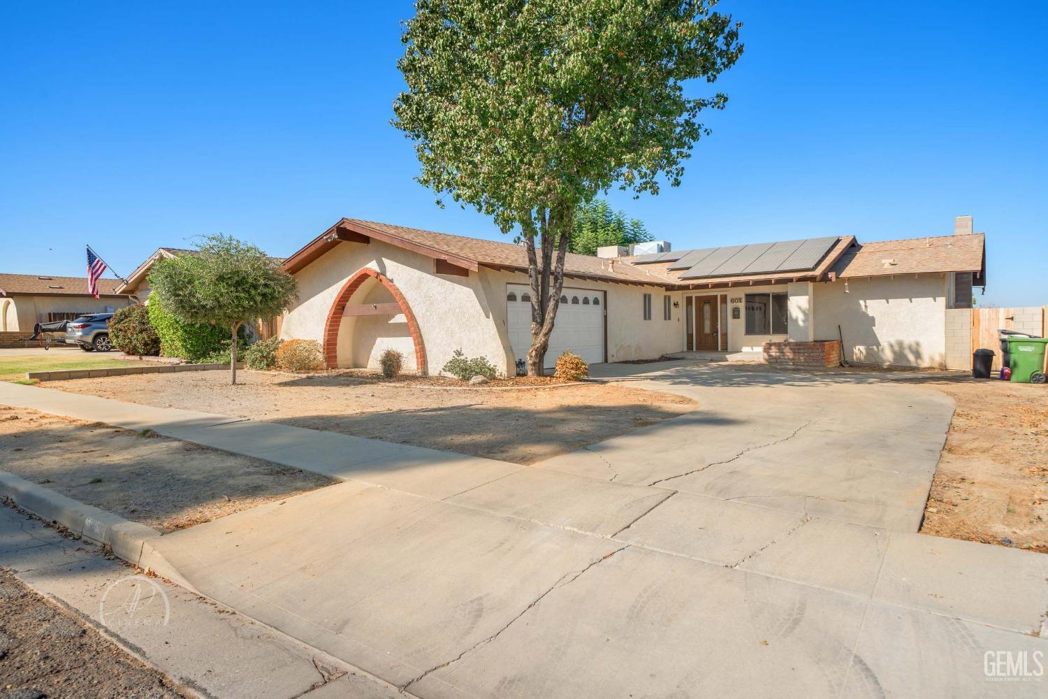 a view of house with yard and entertaining space