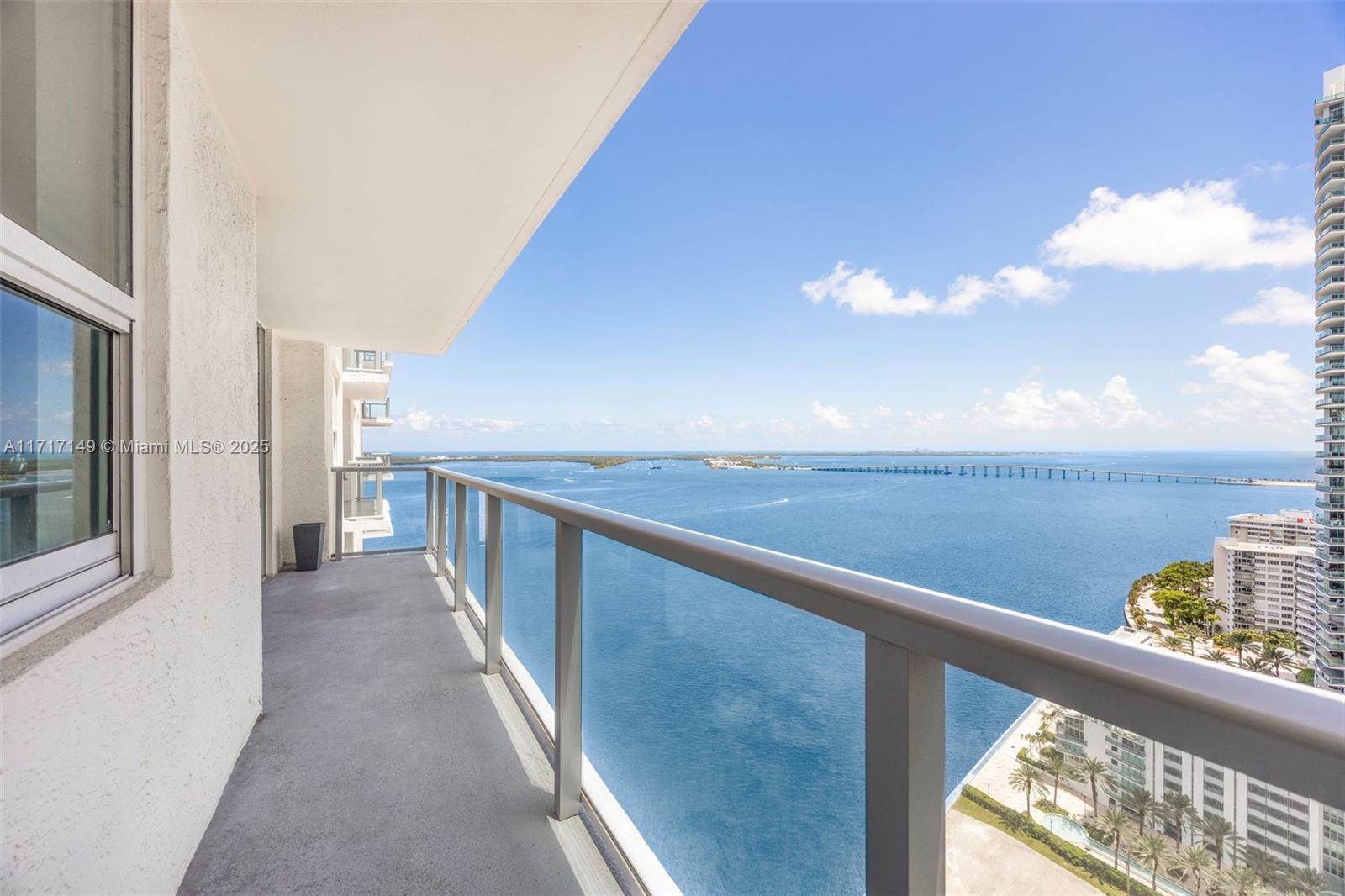 a view of a balcony with an ocean view