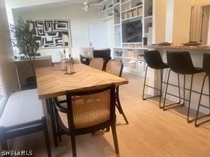 a view of a dining room with furniture and window