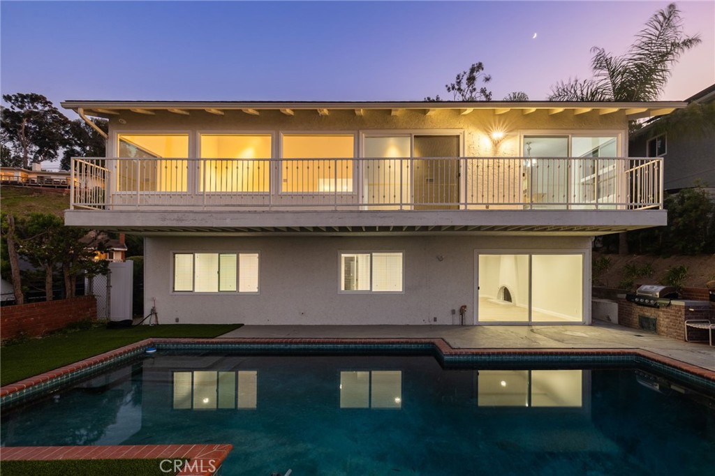 a front view of a house with swimming pool