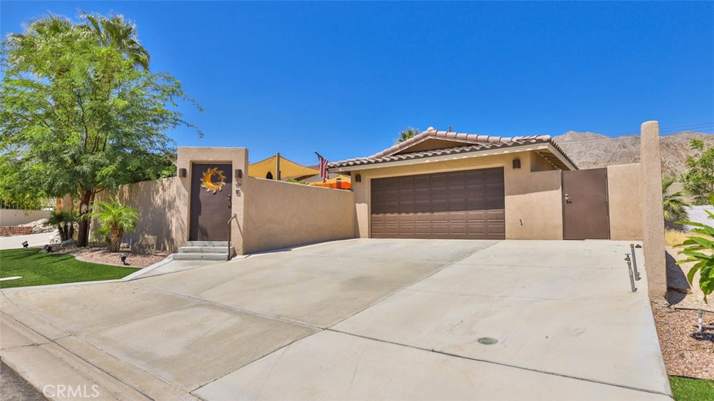 a front view of a house with a garage