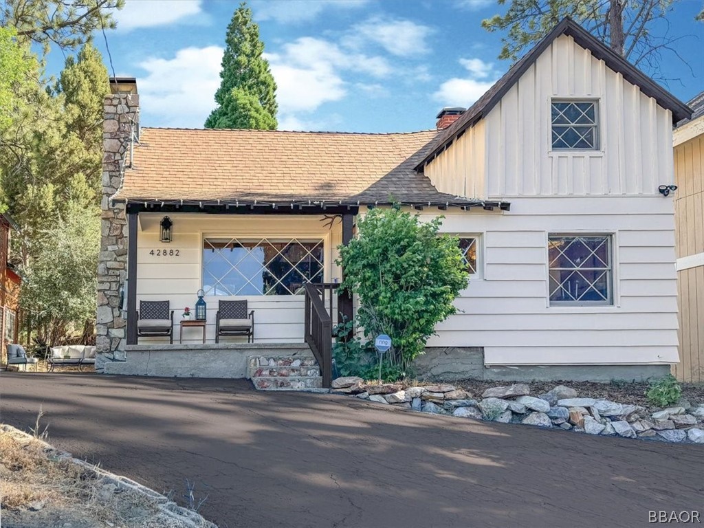 a view of a house with a yard and garage