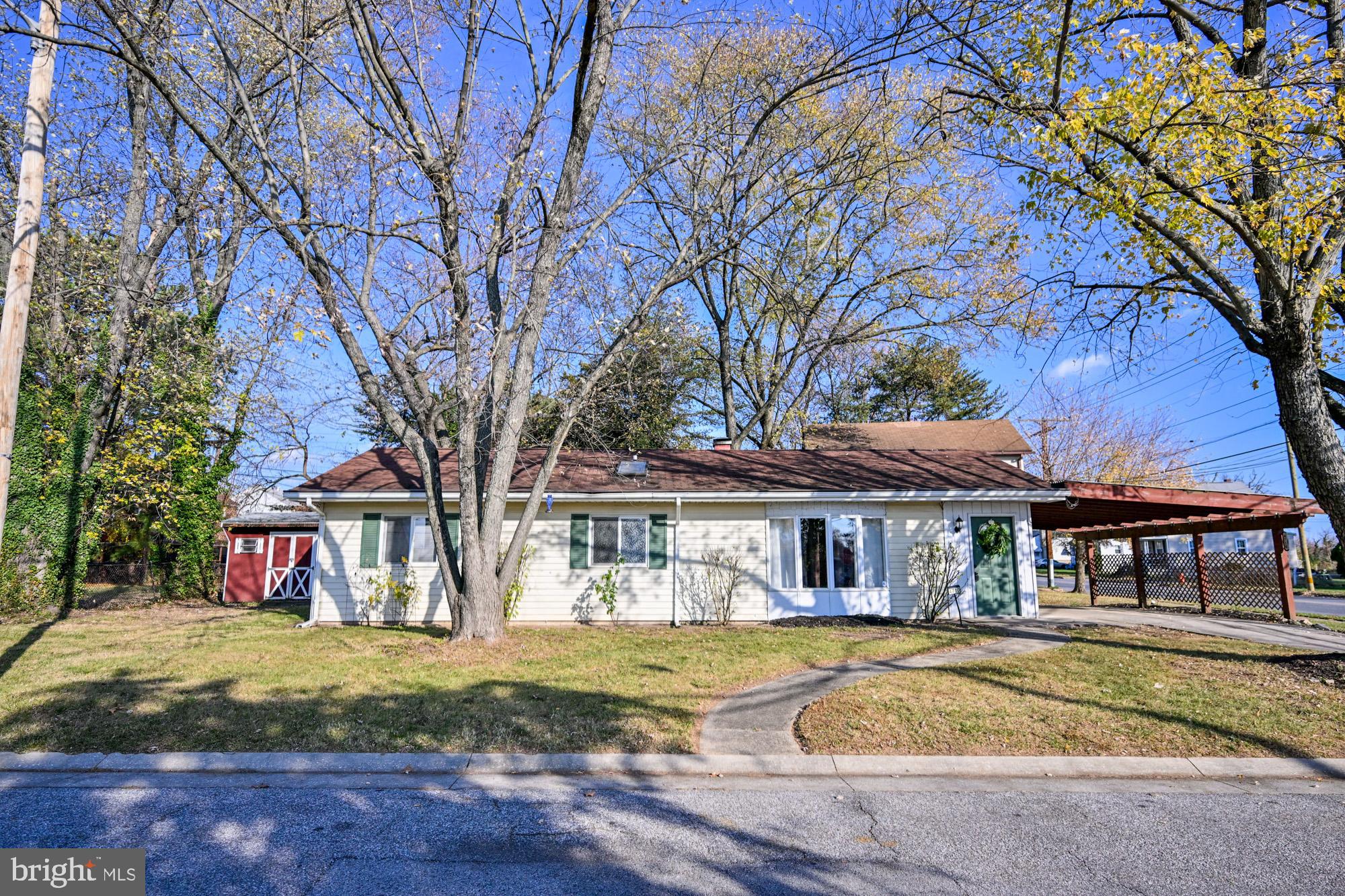 a view of house with outdoor seating