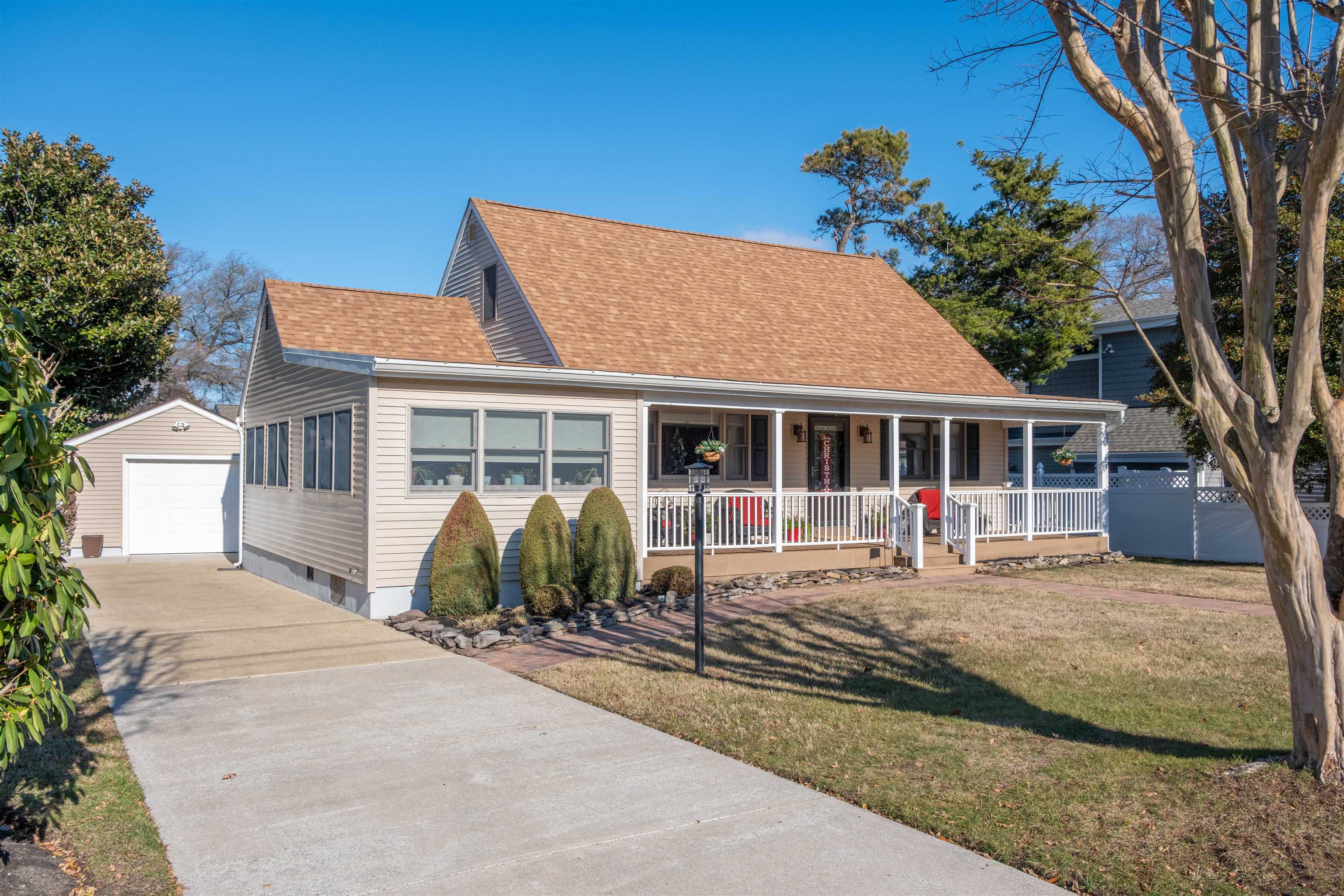 a front view of a house with sitting area