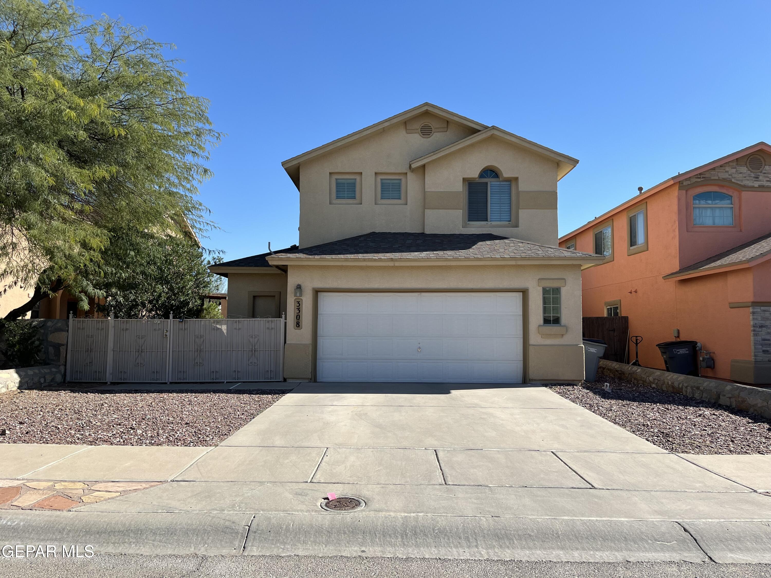 a front view of a house with a garage