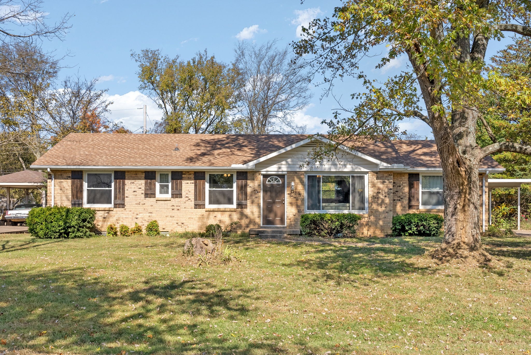 a front view of a house with a yard