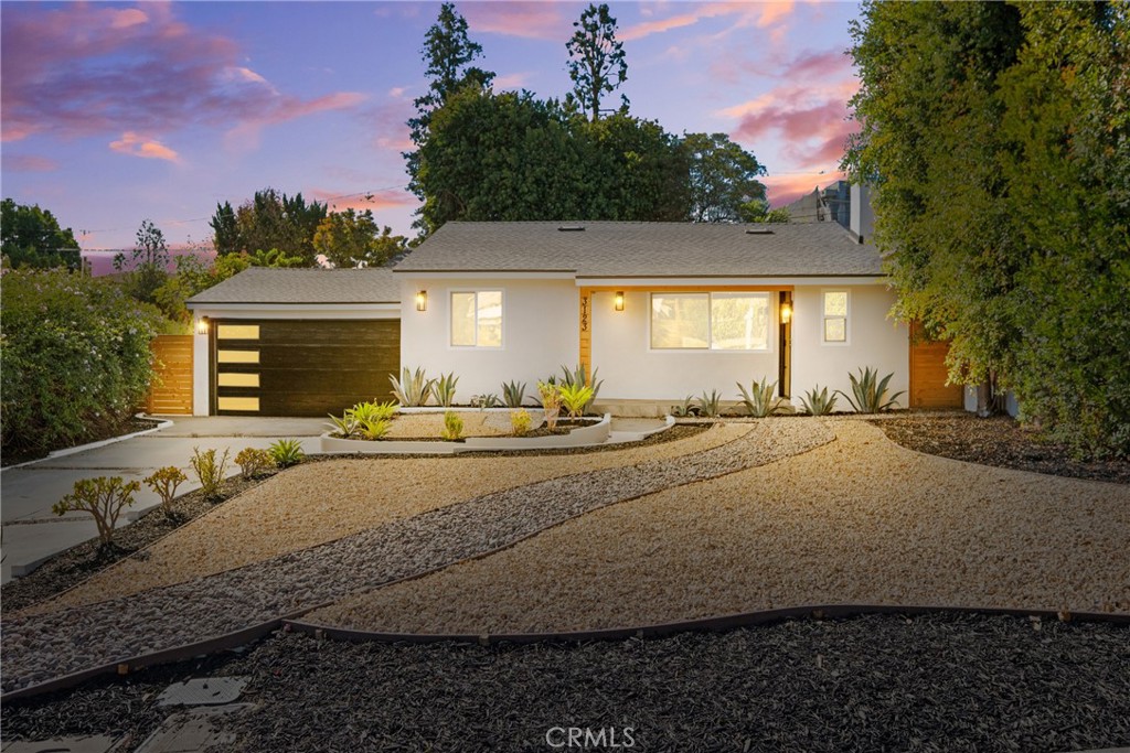 a view of a house with a yard