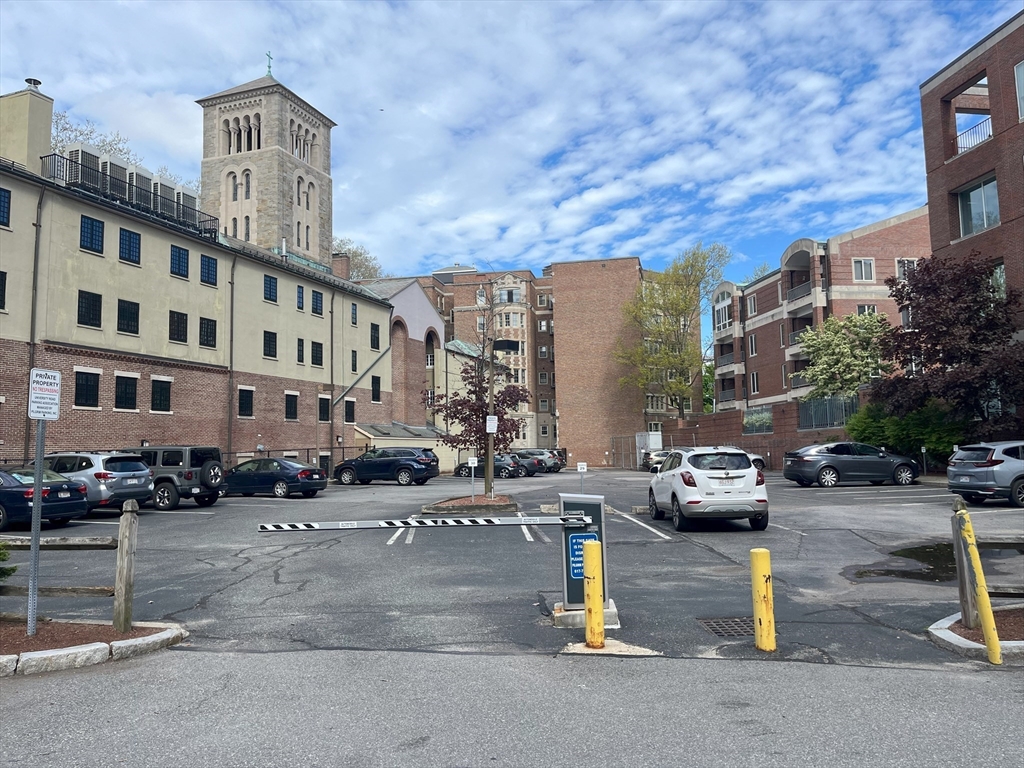 a city street lined with buildings and cars