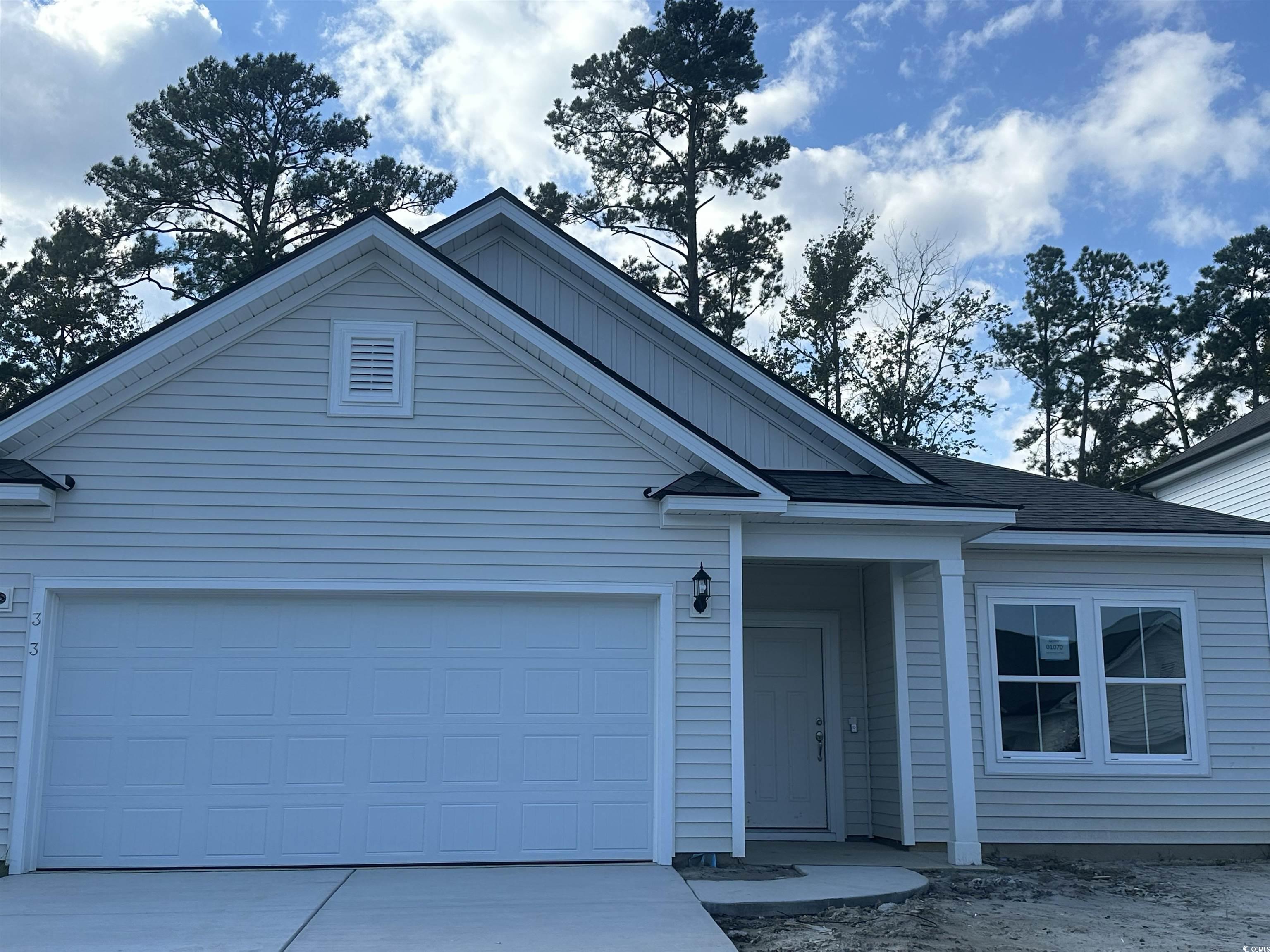 View of front of home featuring a garage