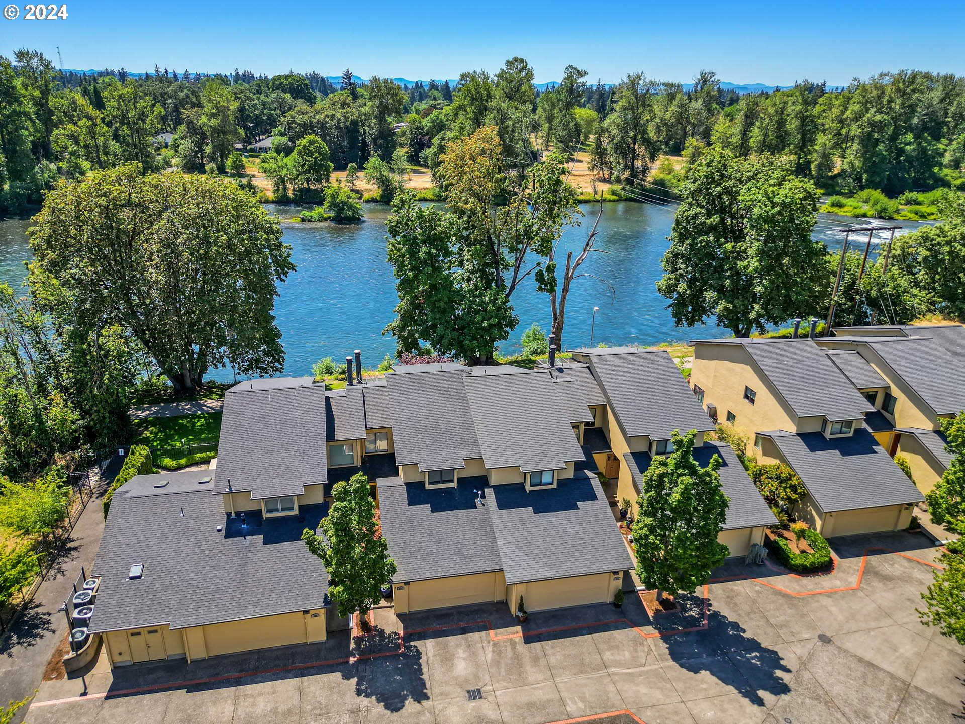 an aerial view of a house with yard swimming pool and outdoor seating